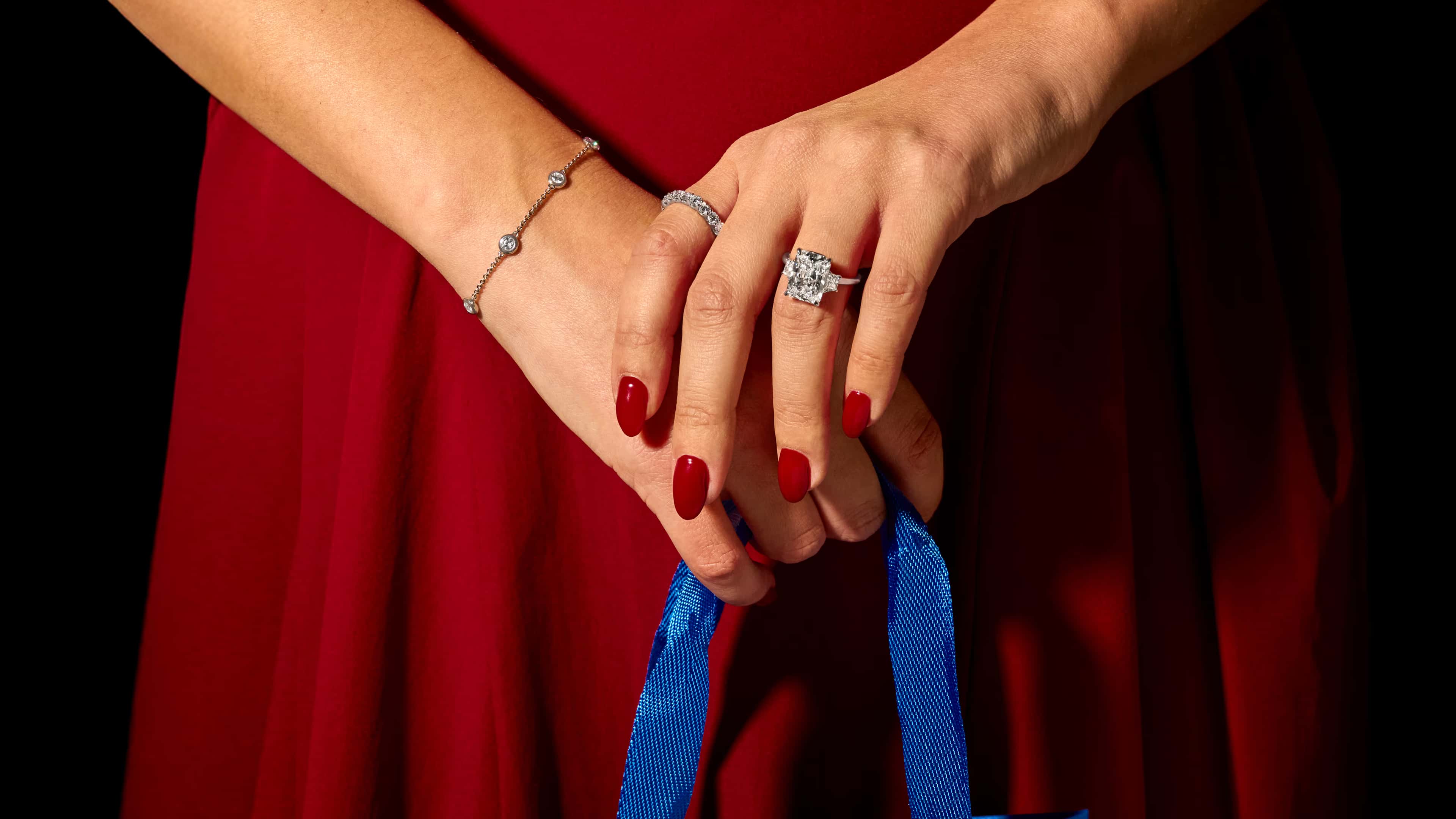 A close-up of an engagement ring with text overlay reading 'Find the Perfect Ring, Make it yours' against a dark background