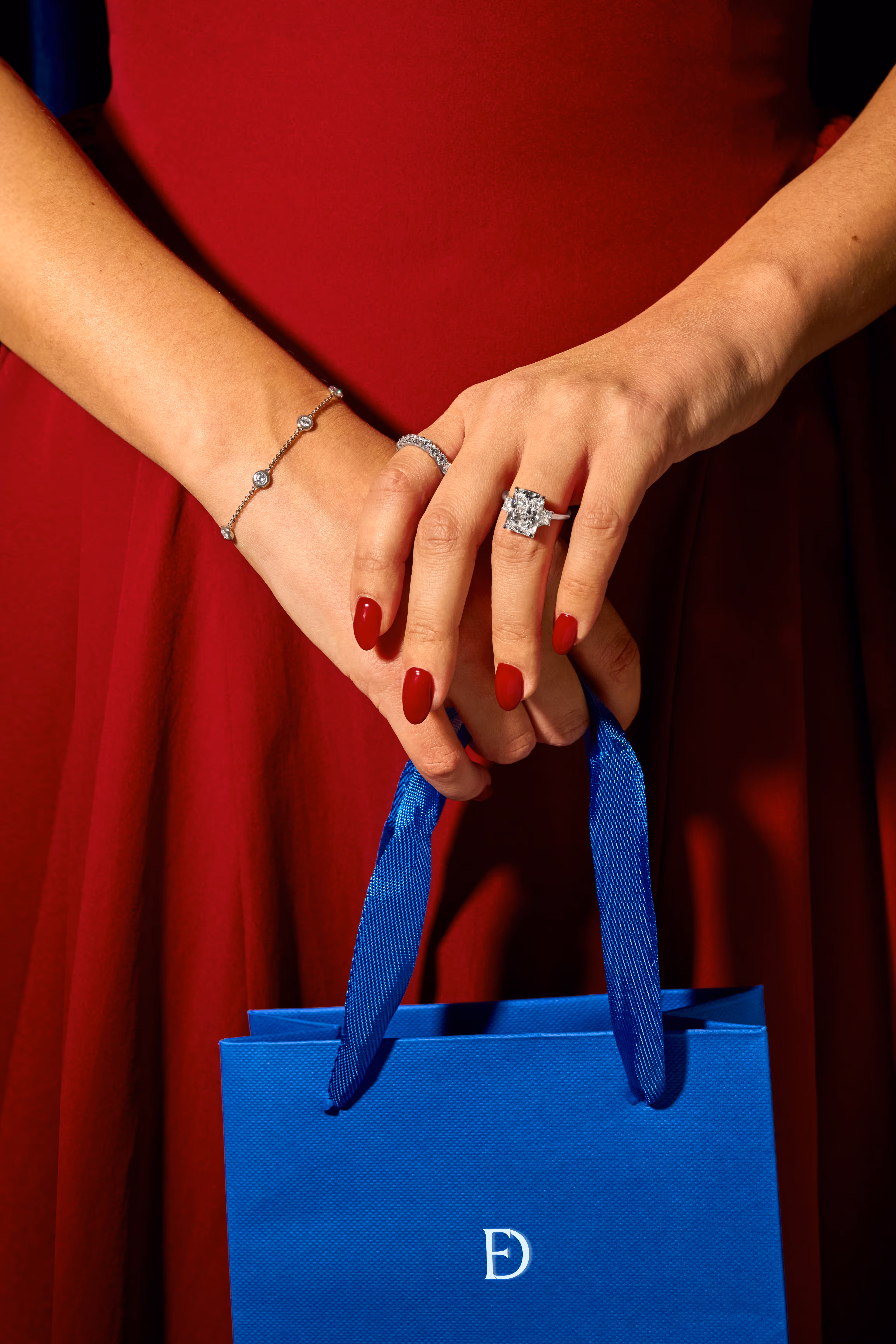 A close-up of an engagement ring with text overlay reading 'Find the Perfect Ring, Make it yours' against a dark background